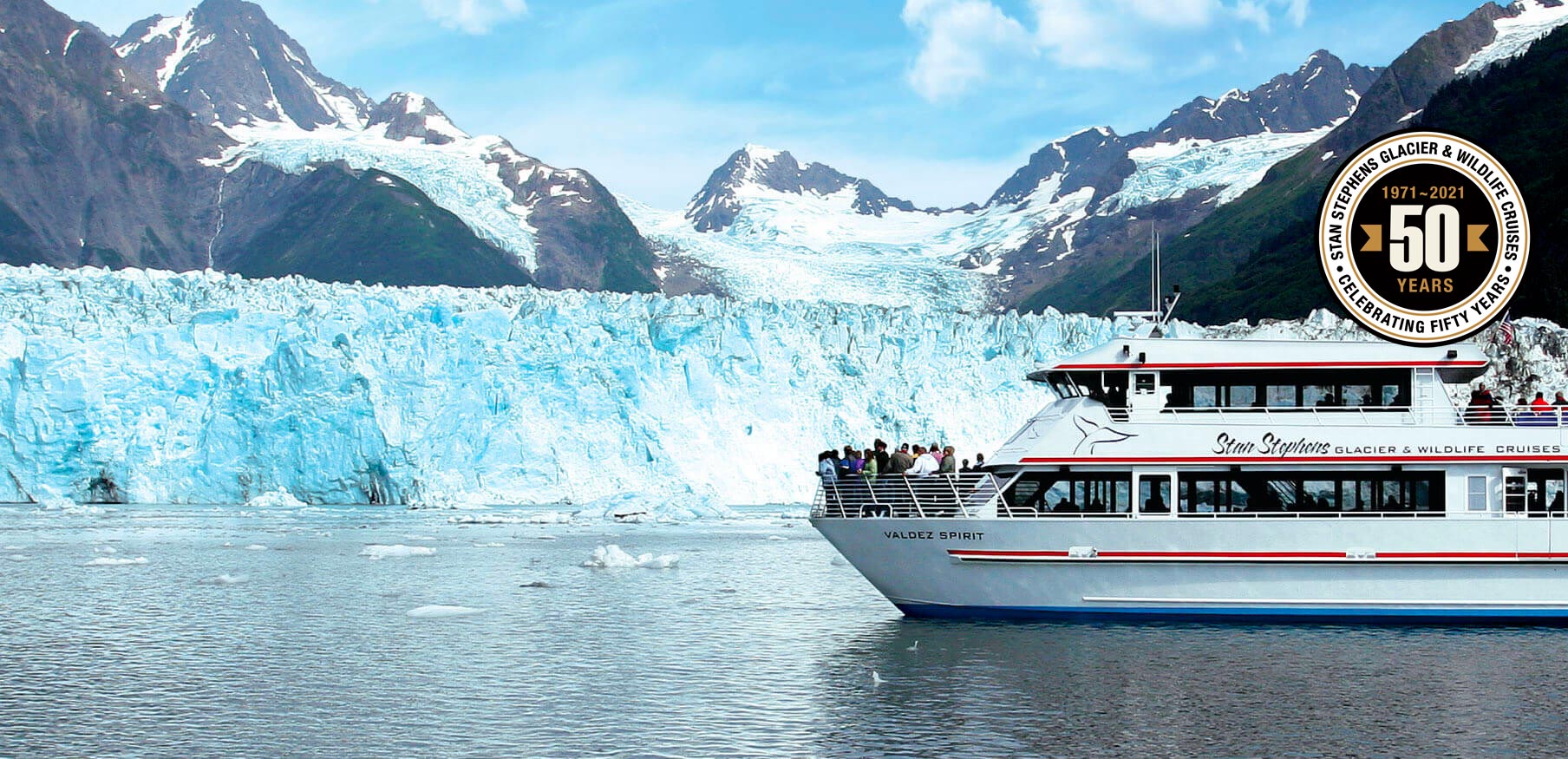 Cruise ship in front of glacier and 50th Anniversary Seal